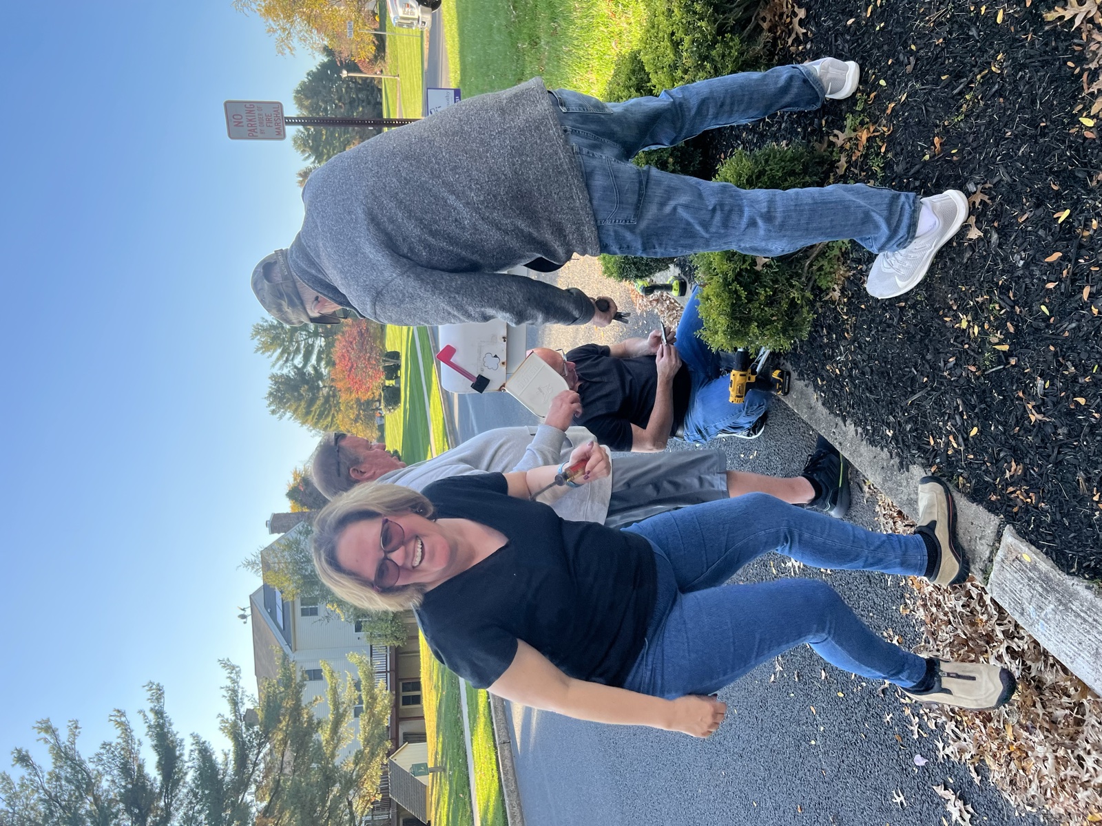 Andrea Michalek and family installing a mailbox